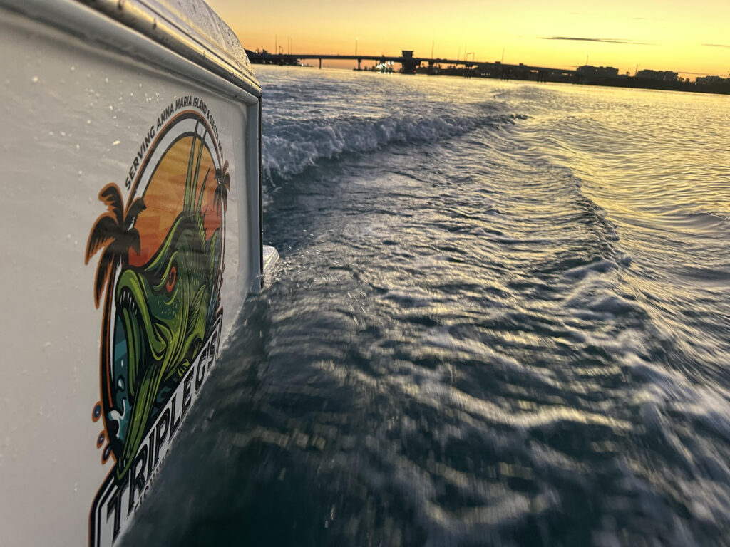 A Triple G's Rentals branded boat displaying the company logo, offering private fishing charters and scenic tours around Anna Maria Island and Siesta Key, Florida.